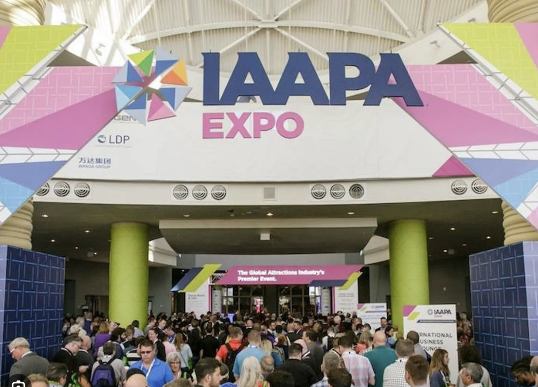 The IAAPA Expo entrance — crowds gathering beneath the large IAAPA Expo banner at the convention centre.