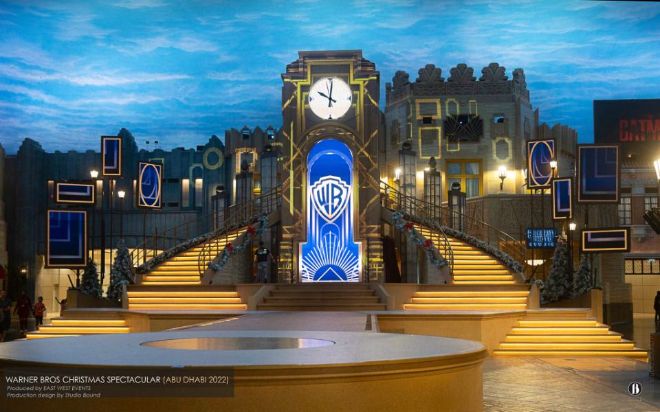 Warner Bros. World Abu Dhabi — central-plaza stage and clock tower built for the 2022 Winter Spectacular, which stayed on as a permanent fixture.