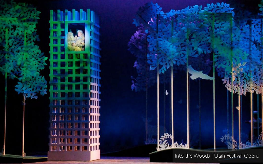Patrick Larsen's Into the Woods at Utah Festival Opera — Rapunzel's lattice tower beside a forest of cut-paper trees.
