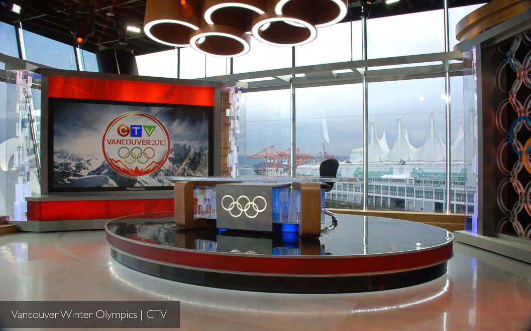 CTV's Vancouver 2010 Winter Olympics broadcast studio — Olympic-ring chandelier above a glass-walled set overlooking Canada Place. BDA Gold winner. Production design by Patrick Larsen.