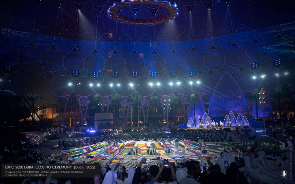 Expo 2020 Dubai closing ceremony, beneath the Al Wasl dome — a Five Currents production with artistic director Franco Dragone. Production design by Patrick Larsen, Studio Bound. Most of the research behind it never appears on stage — but all of it shaped the work.