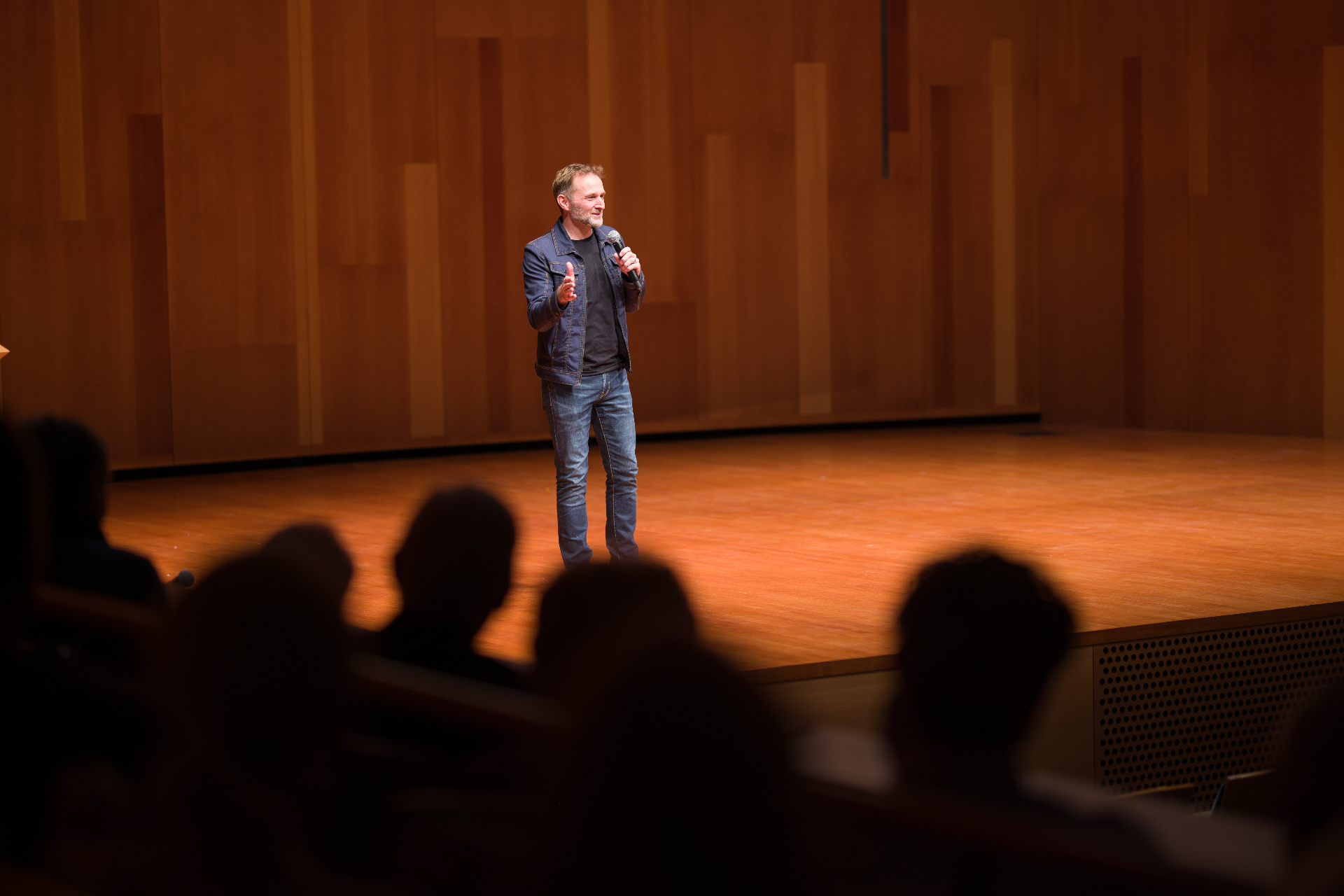 Patrick Larsen speaking on stage